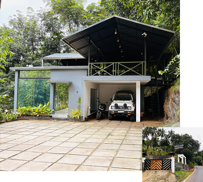 Secure car parking at JKR Gardens: Spacious, well-lit parking area with clear signage, CCTV cameras, and easy access to resort entrances, ensuring guest vehicles are safe and conveniently located. No visible text in the image.