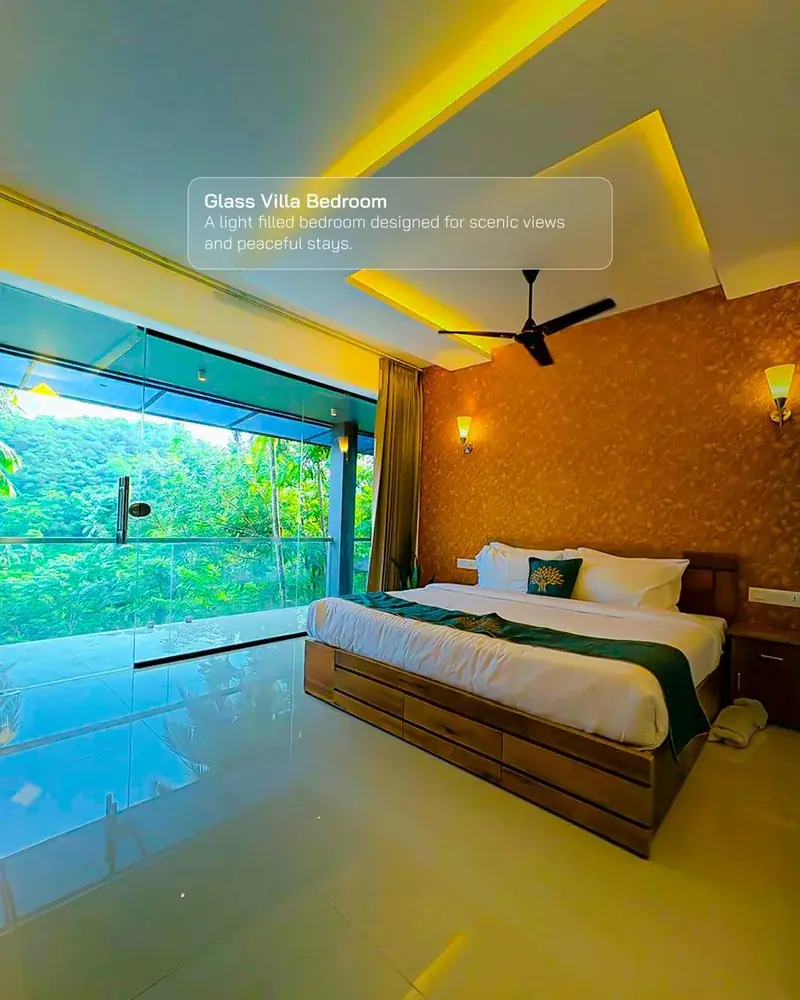 Glass house bedroom with forest view at Vayalada Gardens Resort, Kerala