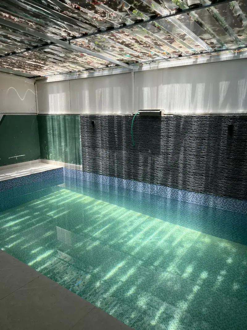 Private pool with stone wall at Vayalada Gardens Resort