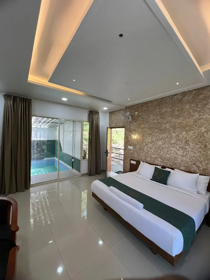 Room with pool visible through glass