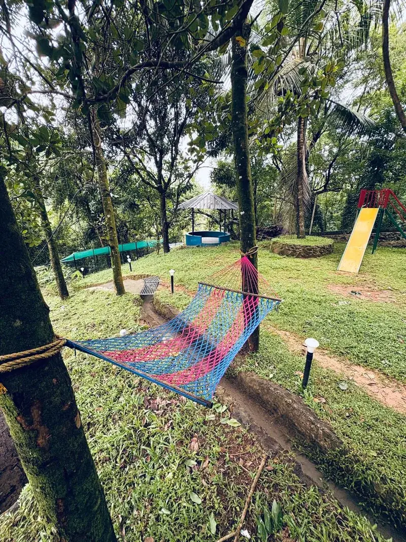 Kids play area and hammock lawn at Vayalada Gardens Resort