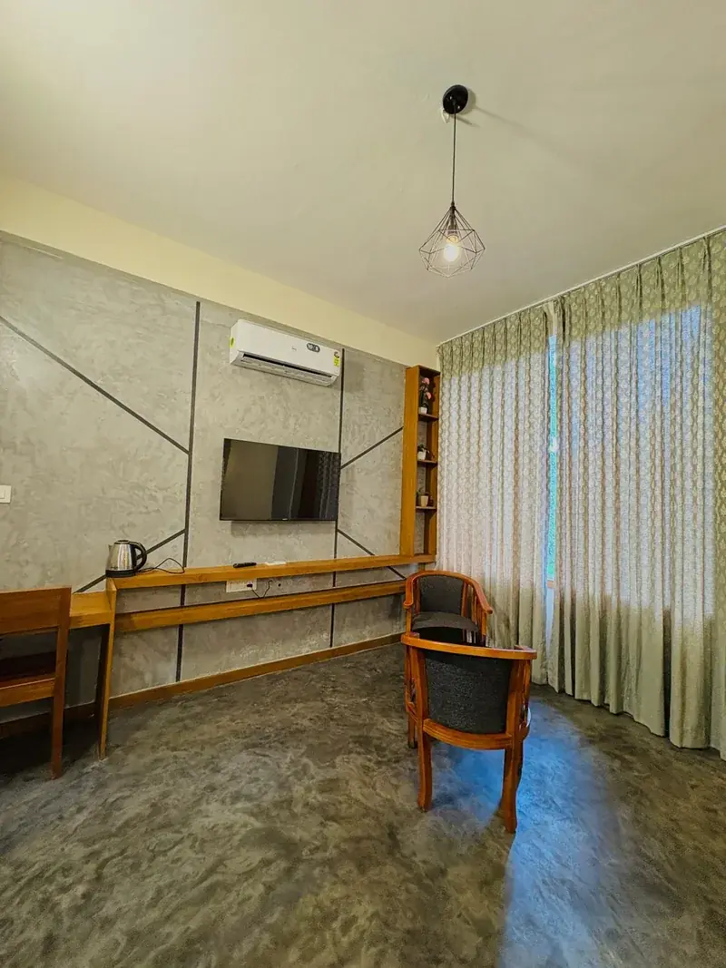 Room with grey wall panel and curtains