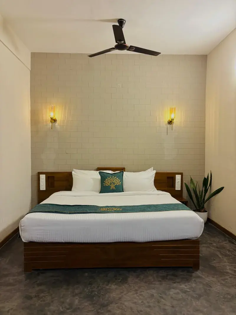 Room with bed and wall lamps