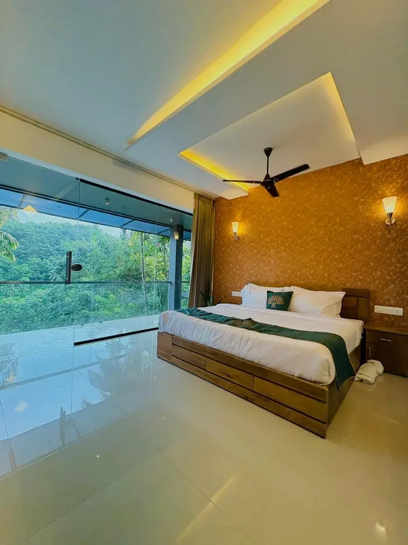 Suite bedroom with large window over the Vayalada hills