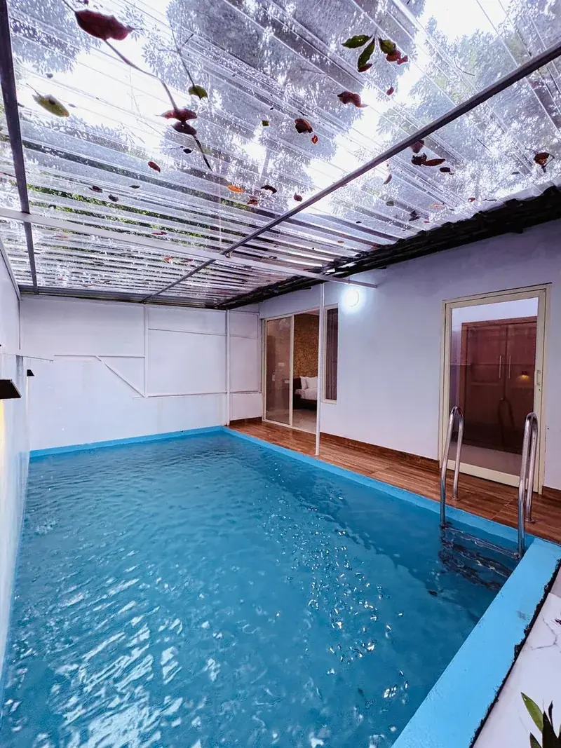 Pool villa interior with glass ceiling near Vayalada, Kozhikode